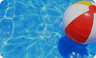 Beach ball floating in a pool